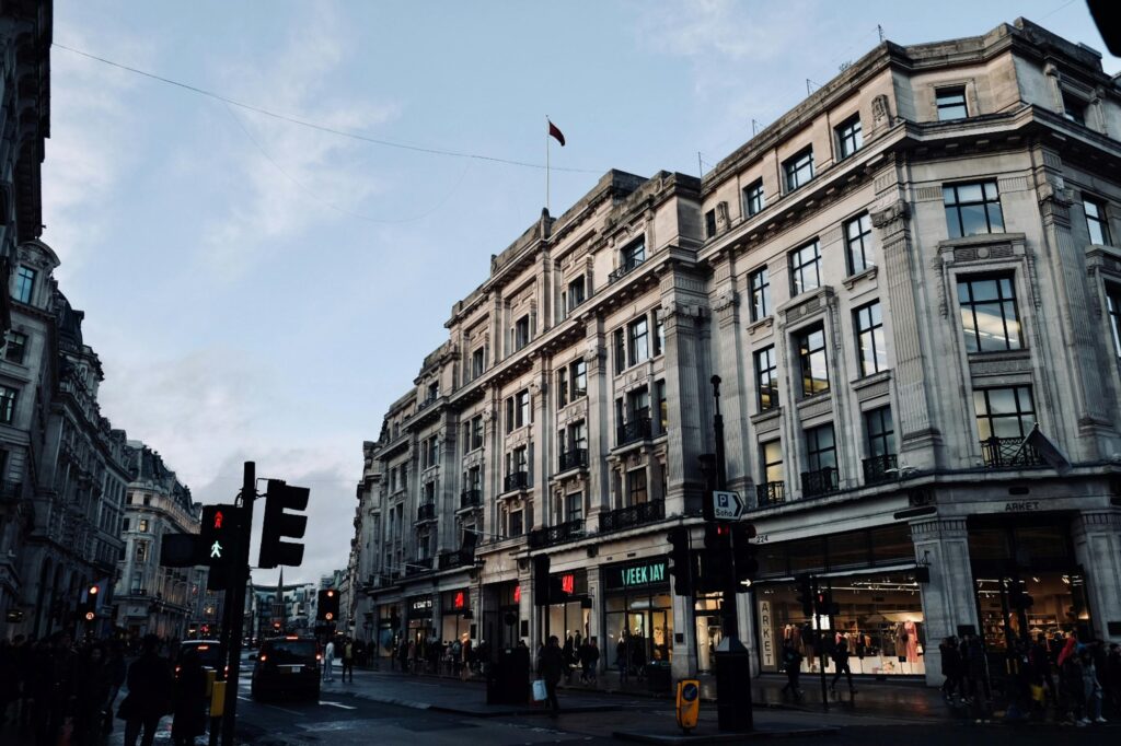A building with shops on the corner of the street