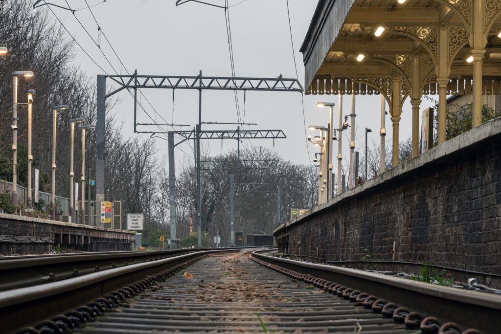 Low-angle shot of a railway in the concept of 'how to use Surbiton's public transport'.