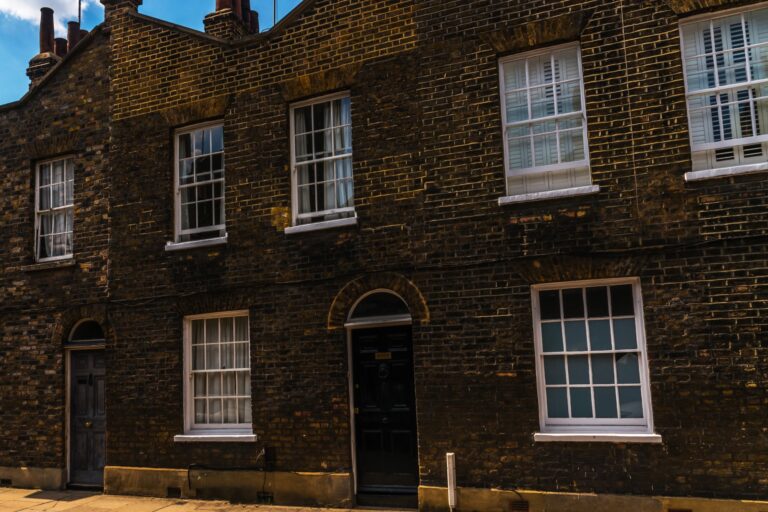 Big brick house in the concept of 'best affordable housing options in Surbiton'.