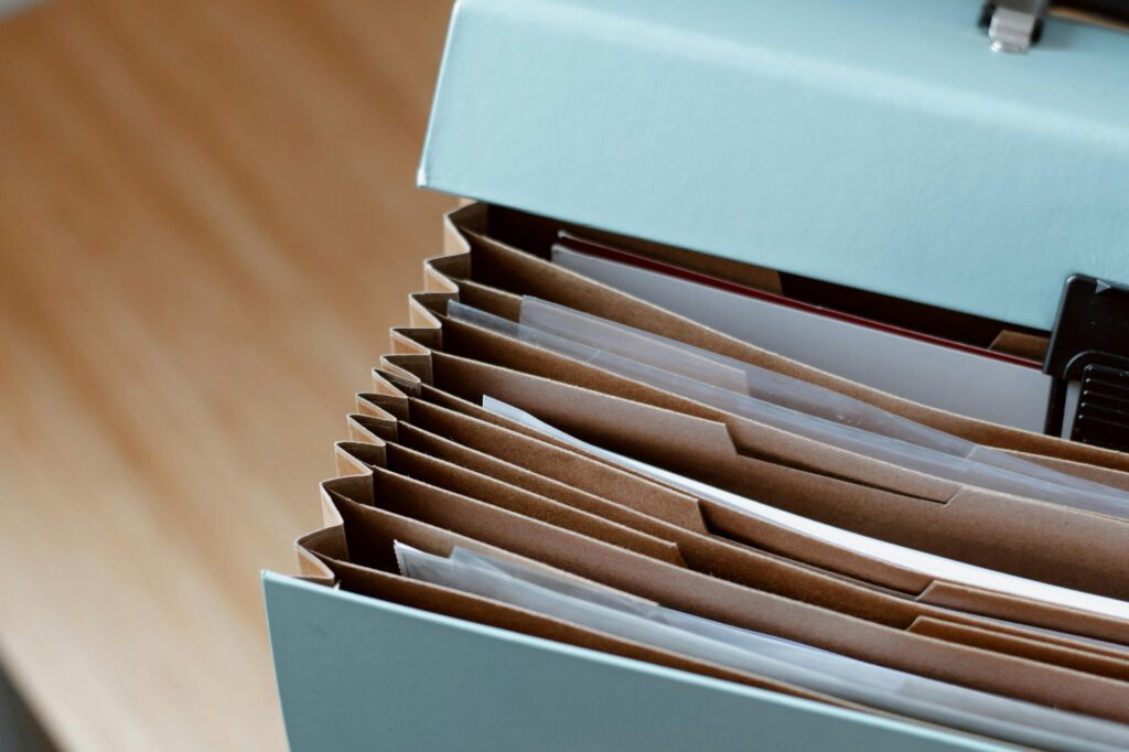 Cropped image of important documents in an accordion organiser in preparation for the move