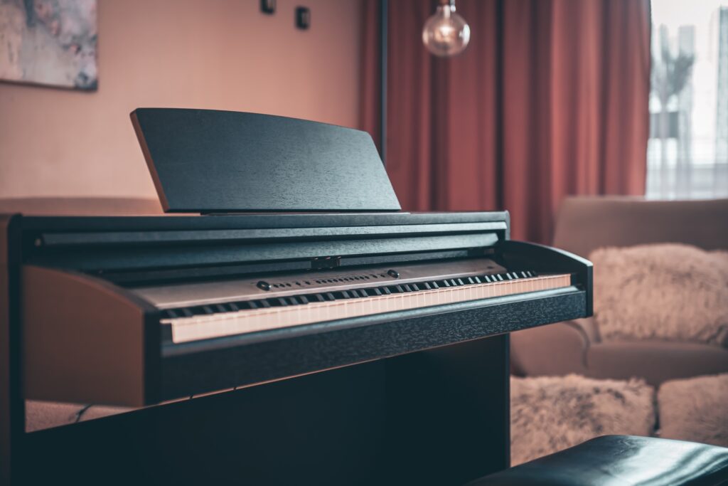 An electric piano in the living room in the concept of 'How to Move Pianos and Other Large Fragile Objects When Moving House to Surbiton'.