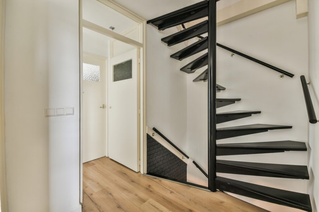 A slightly narrow spiral staircase in a modern flat